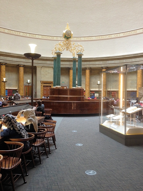 A reading room lined with books.